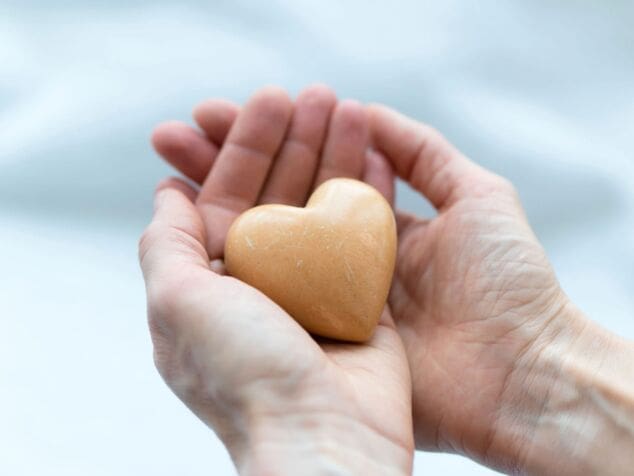 stone-like-heart-holded-in-hands-2022-08-01-04-45-37-utc-min hands holding heart-shaped stone