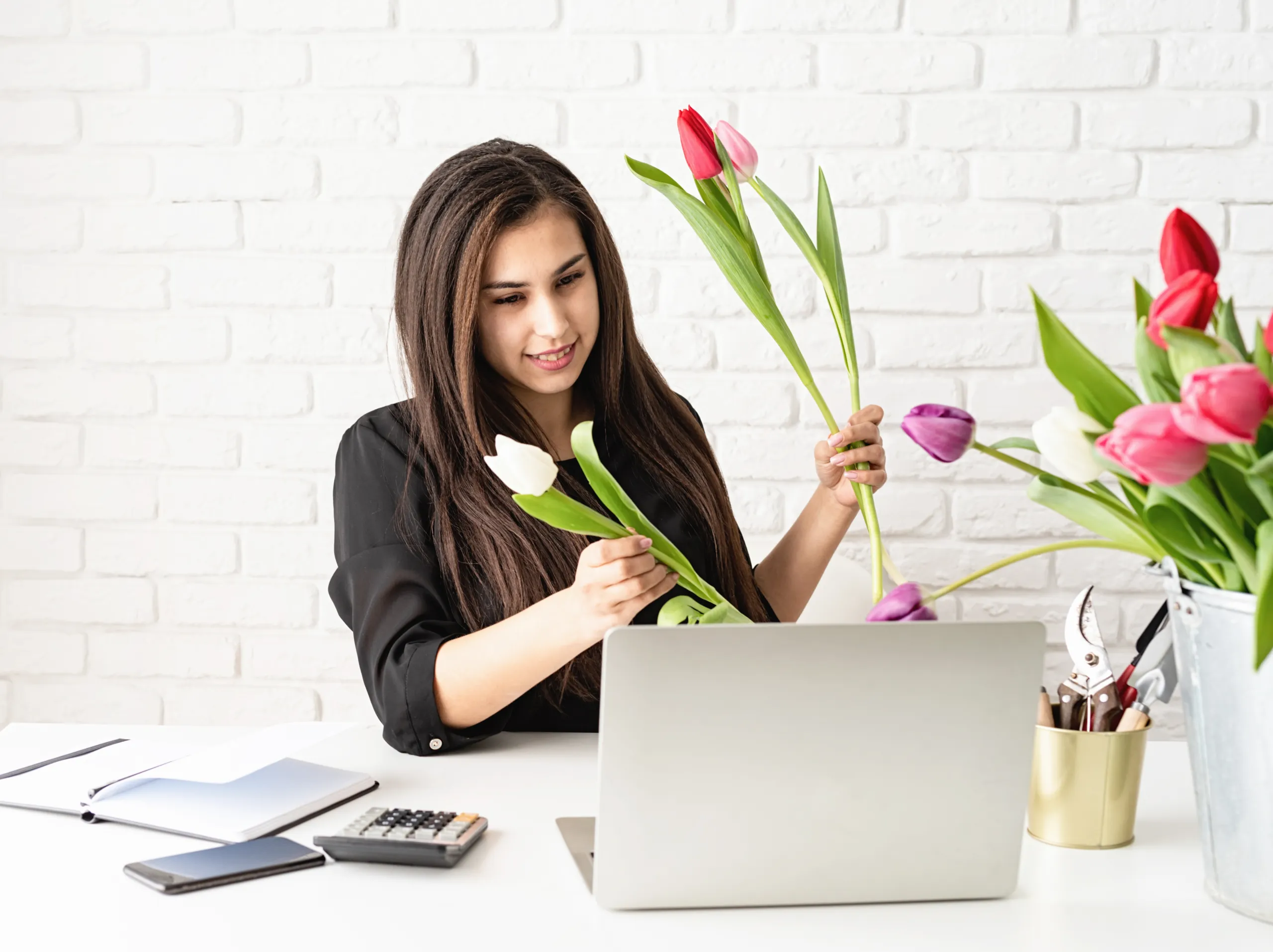 young-florist-woman-working-with-client-online-se-2022-11-16-20-32-45-utc florist lady working with clients online
