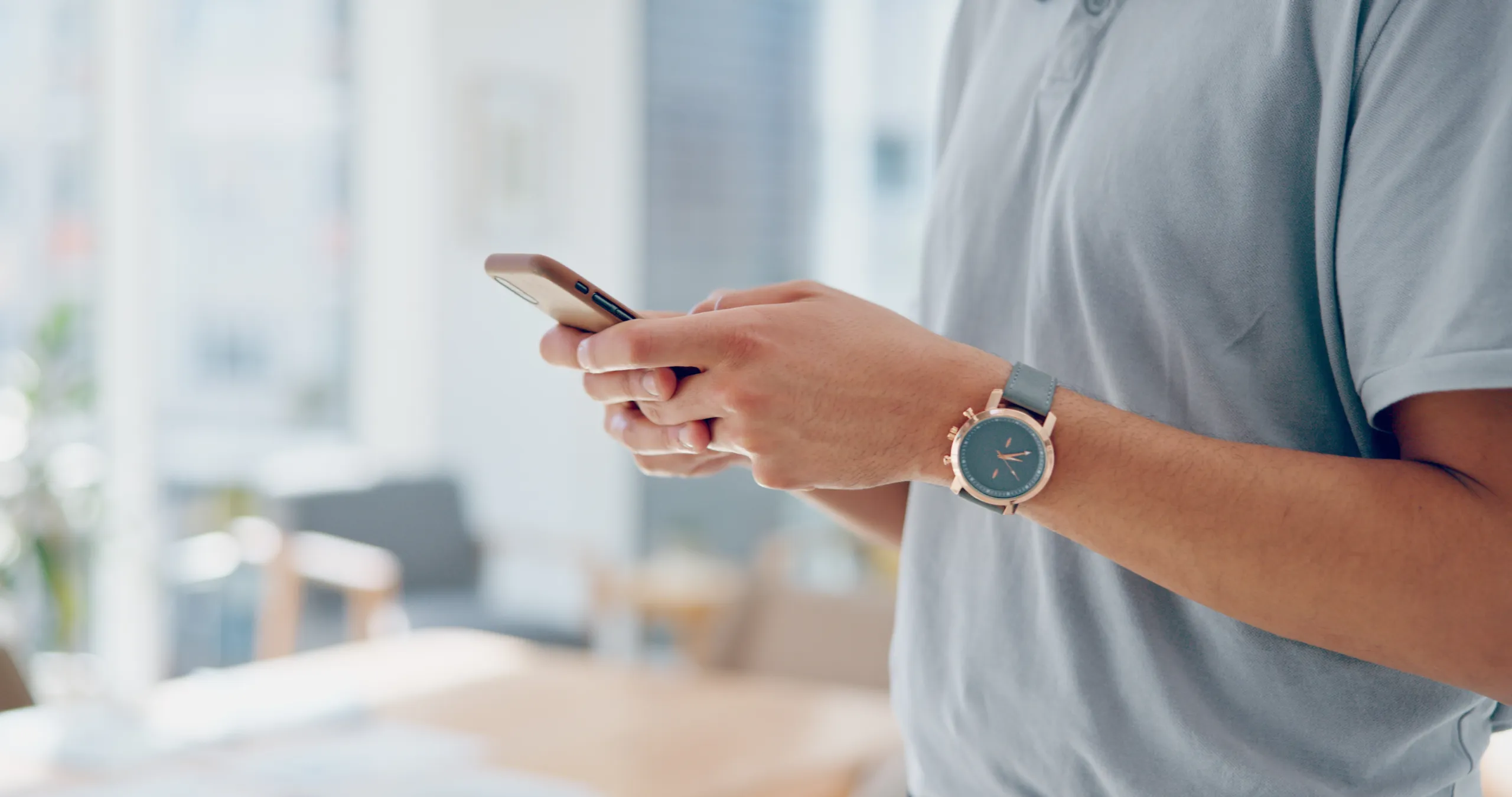 hands-phone-and-chat-app-in-office-for-communicat-2023-11-27-05-01-15-utc