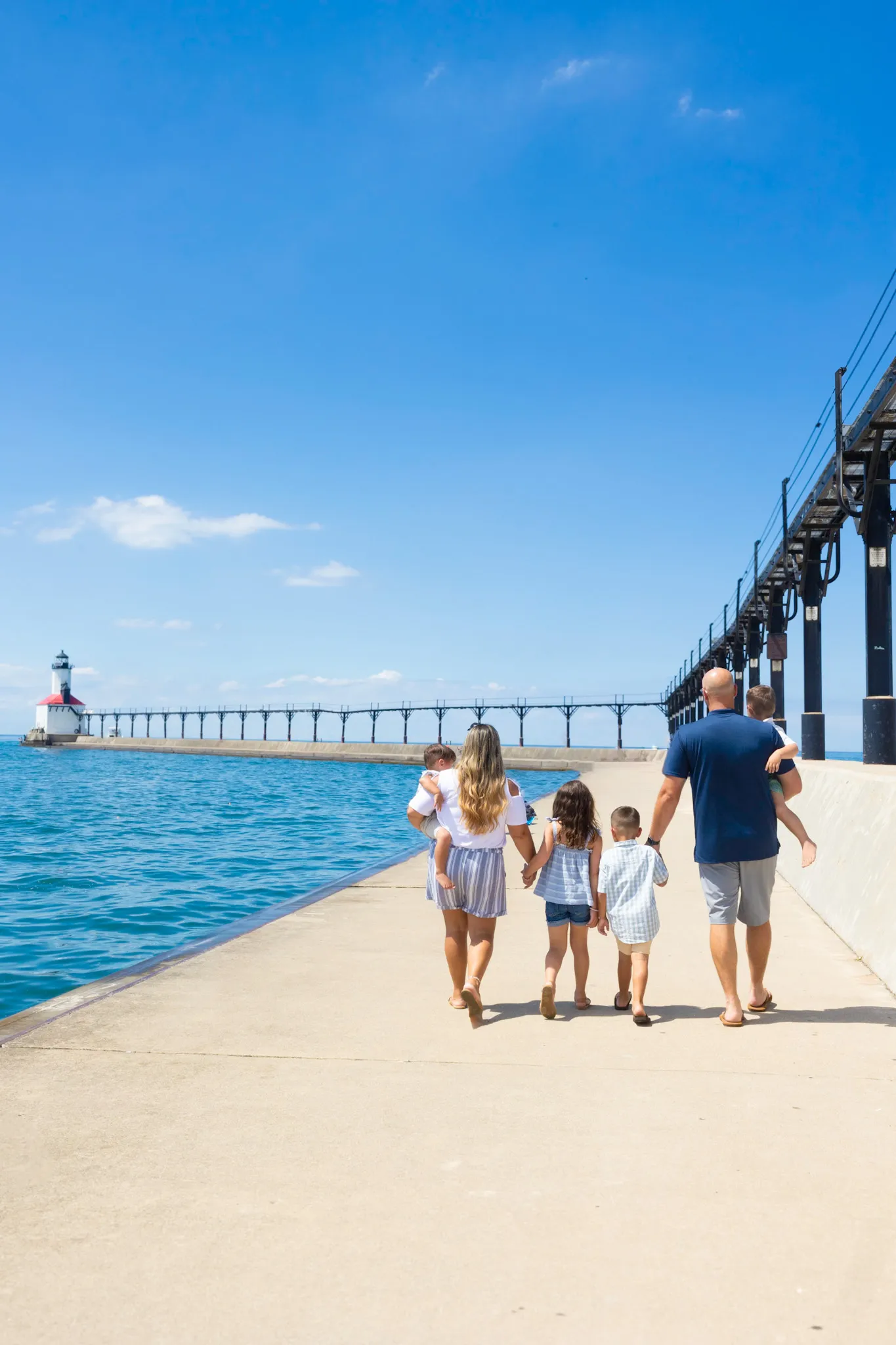Family walking on pier in Michigan City, Indiana